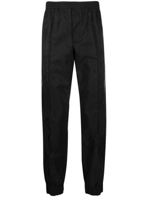 logo-print tapered trousers by HELMUT LANG