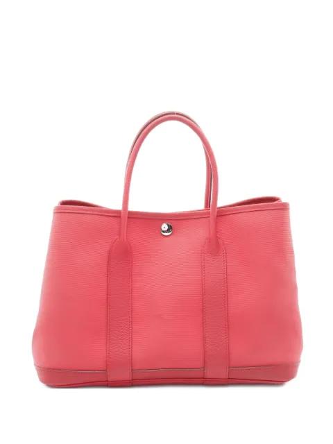 2009 Garden Party leather trim handbag by HERMES 