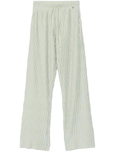 wrinkled-effect trousers by HERNO