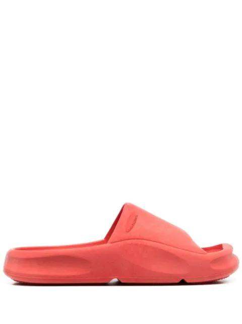 logo-embossed rubber slides by HERON PRESTON