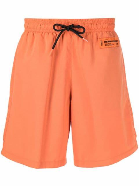 logo-patch swim shorts by HERON PRESTON