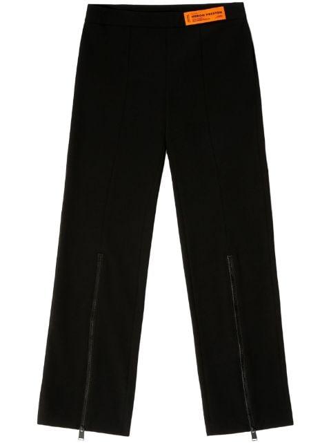 logo-patch zip-up trousers by HERON PRESTON