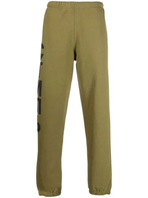 logo-print track pants by HERON PRESTON