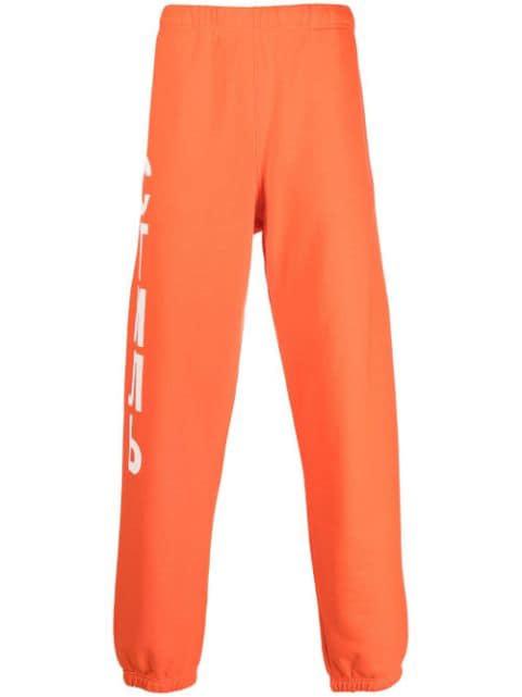 logo-print track pants by HERON PRESTON