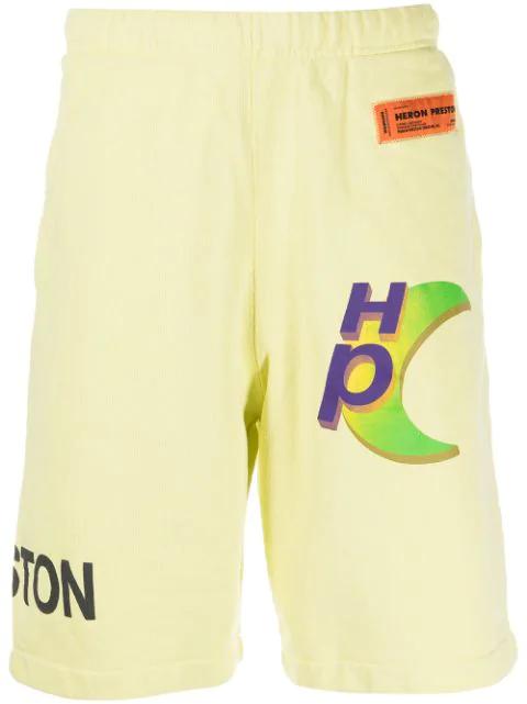logo-print track shorts by HERON PRESTON