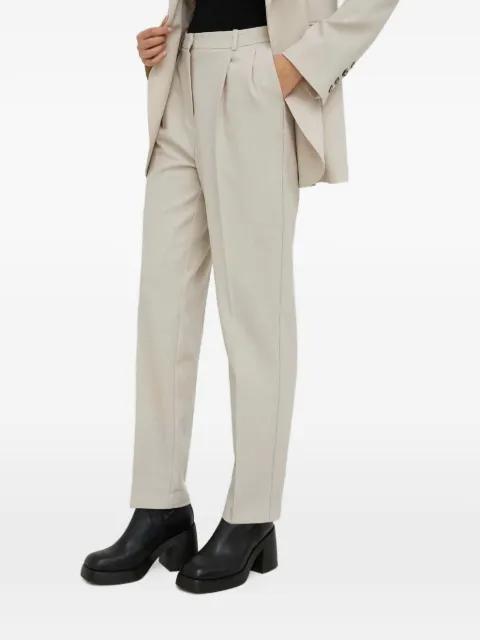 pleated trousers by HERSKIND