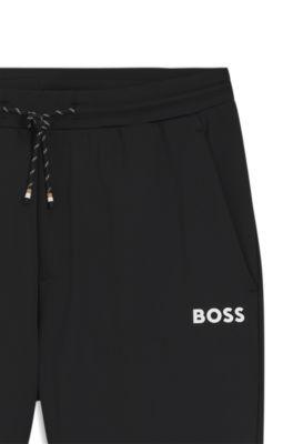 Active Stretch-gabardine tracksuit bottoms with zipped hems by HUGO BOSS