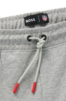 BOSS x NFL signature-tape tracksuit bottoms with special branding by undefined BOSS x NFL signature-tape tracksuit bottoms with special branding by undefined