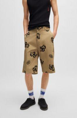 Baggy-fit shorts in hibiscus-print stretch-cotton twill by HUGO BOSS Baggy-fit shorts in hibiscus-print stretch-cotton twill by HUGO BOSS