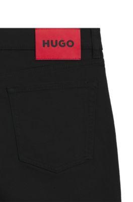 Black tapered-fit jeans in thermo-regulating denim by HUGO BOSS