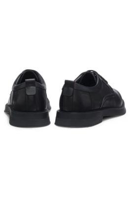 Derby shoes in leather with perforated monograms by HUGO BOSS