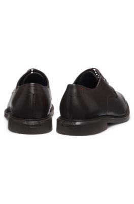 Embossed-logo Derby shoes in leather by HUGO BOSS
