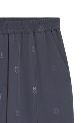 Relaxed-fit trousers with stacked logos by HUGO BOSS