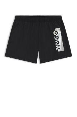 Swim shorts with metallic split logo by HUGO BOSS