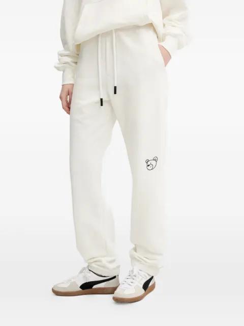 graphic-embroidered drawstring track pants by INBETWEENERS