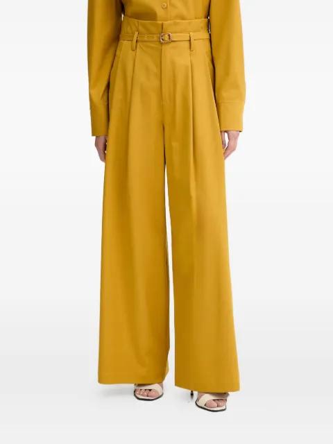 belted pleated palazzo pants by ISABELLE BLANCHE