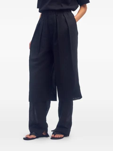 Paper-esque pleated trousers by ISSEY MIYAKE