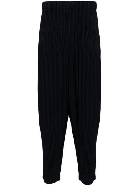 pleated tapered trousers by ISSEY MIYAKE