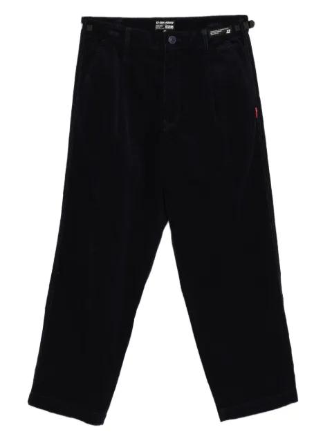 logo-patch trousers by IZZUE