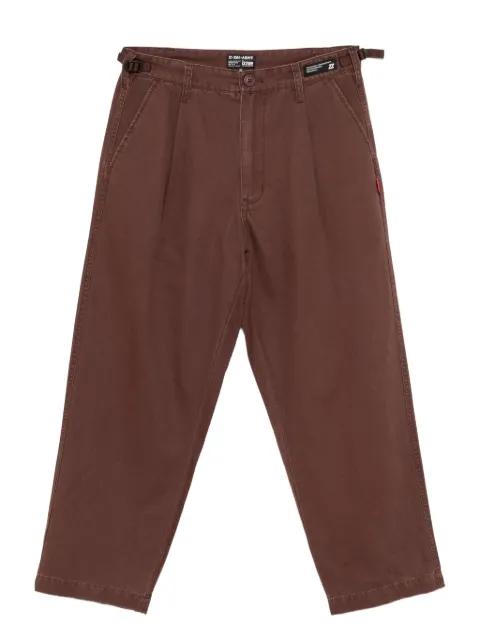 logo-patch trousers by IZZUE