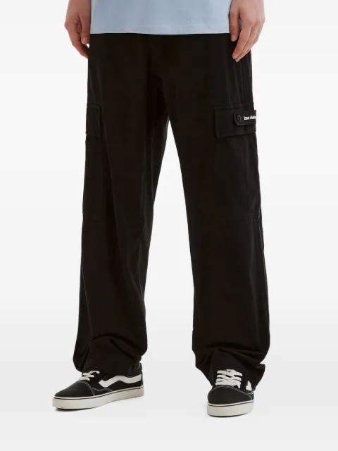 logo-patch trousers by IZZUE