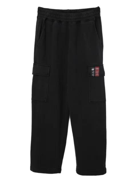 logo-patch trousers by IZZUE