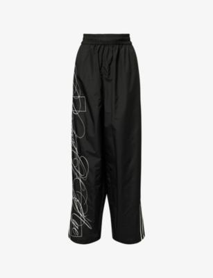 Script Embroidered Shell Jogging Bottoms by JADED LONDON