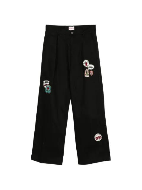 patch-detail pleated trousers by KAMIYA