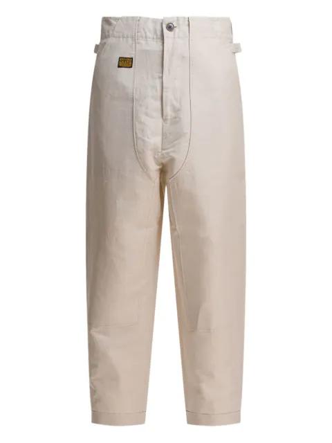 logo-patch trousers by KAPITAL