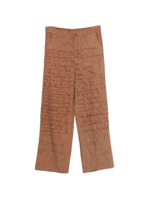 embroidered scribble-pattern trousers by KIDSUPER STUDIOS