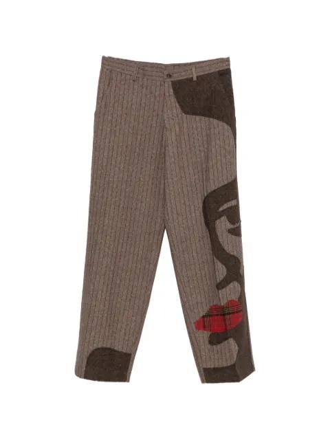 pinstripe face-patchwork trousers by KIDSUPER STUDIOS