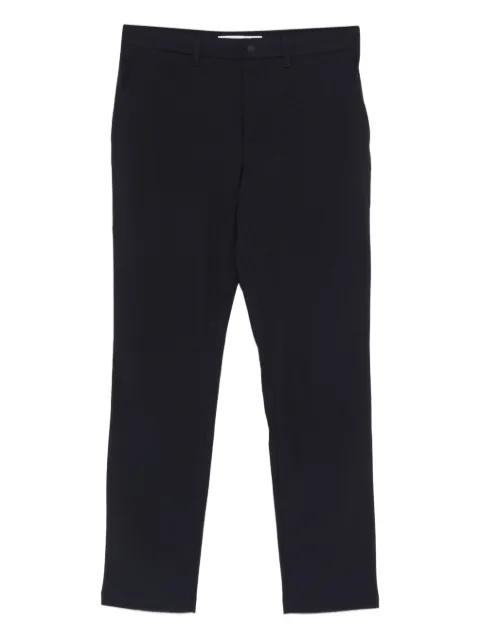 Buttoned trousers by LACOSTE