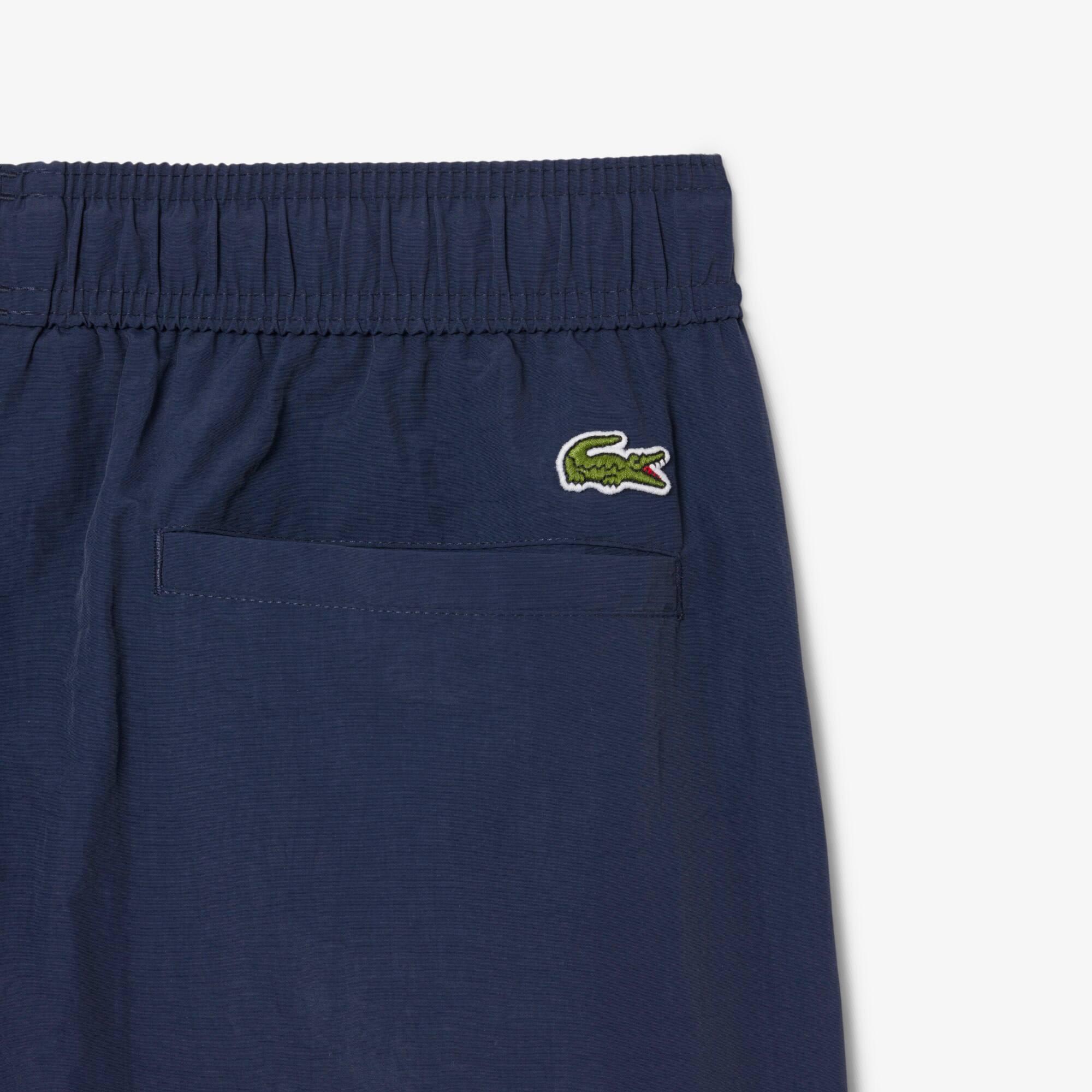 Men's Short Badge Accent Swim Trunks by LACOSTE