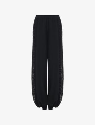 Mesh-Panel Relaxed-Fit Knitted Trousers by LEEM