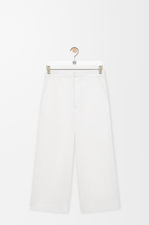 Cropped trousers in denim by LOEWE