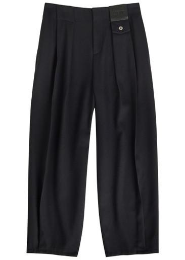 Logo-appliquéd barrel-leg wool trousers by LOEWE