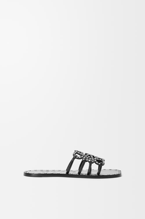 Petal Anagram slide in vegetable-tanned calfskin and metallic studs by LOEWE