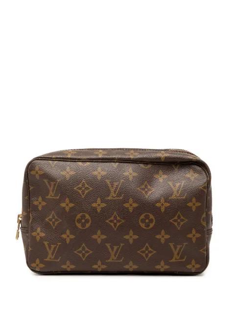 1990 Monogram Trousse Toilette 23 clutch bag by LOUIS VUITTON 