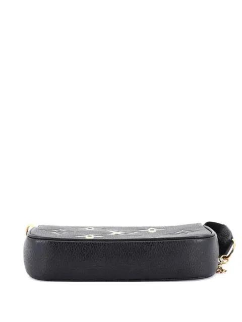 Pochette Accessoires Bicolor Monogram Empreinte Giant Mini clutch bag by LOUIS VUITTON 