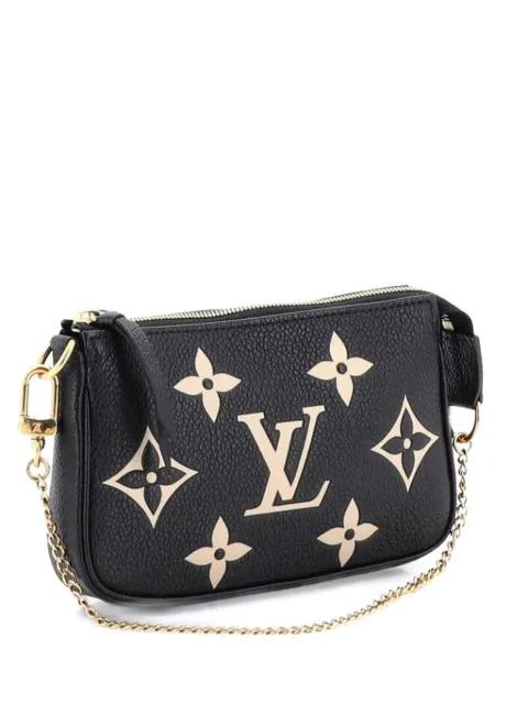 Pochette Accessoires Bicolor Monogram Empreinte Giant Mini clutch bag by LOUIS VUITTON 