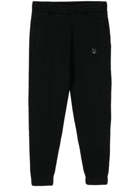 logo-embroidered track pants by MAISON KITSUNE