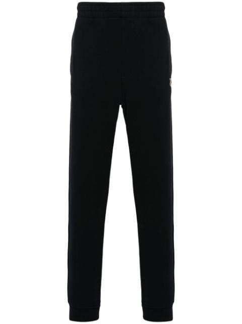 tapered track pants by MAISON KITSUNE