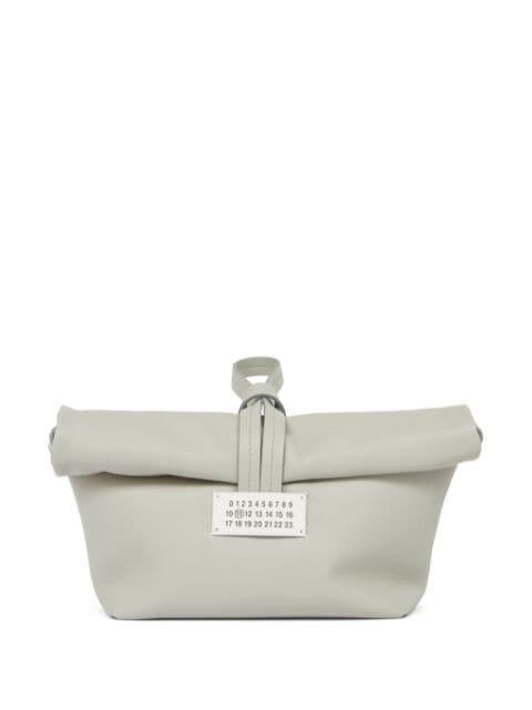 Paper leather clutch bag by MAISON MARGIELA