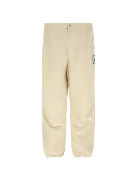 ripstop logo patch trousers by MAISON MIHARA YASUHIRO