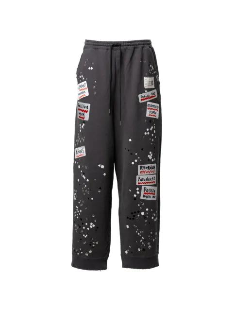 stud-embellished patch-detail track pants by MAISON MIHARA YASUHIRO