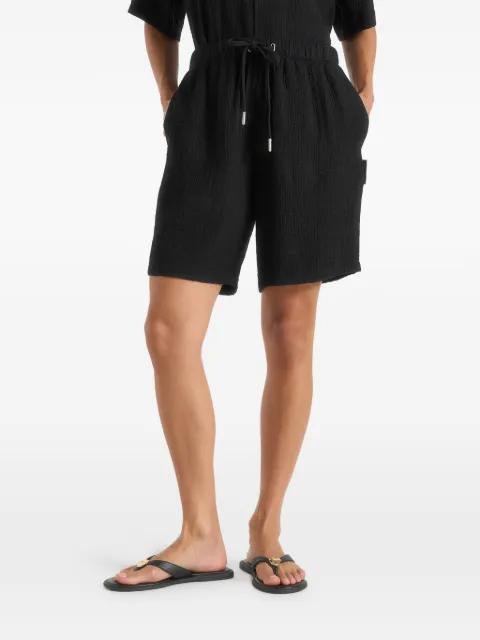 Ari in black textured shorts by MANIERE DE VOIR