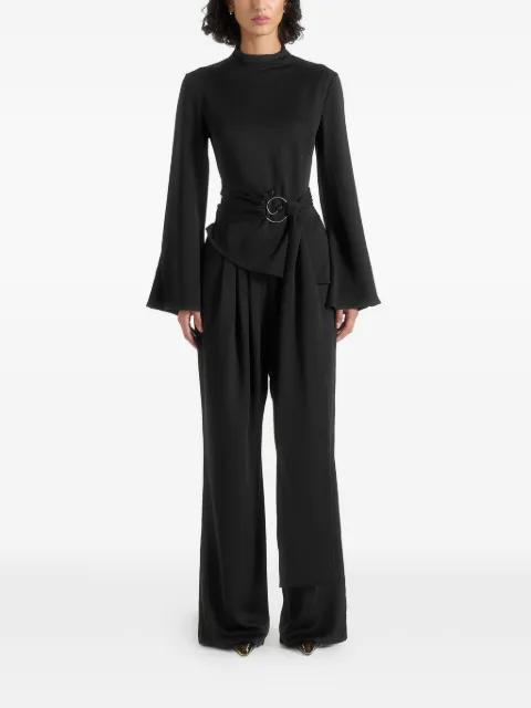 Aurore in black mock neck ring belt pleated leg jumpsuit by MANIERE DE VOIR