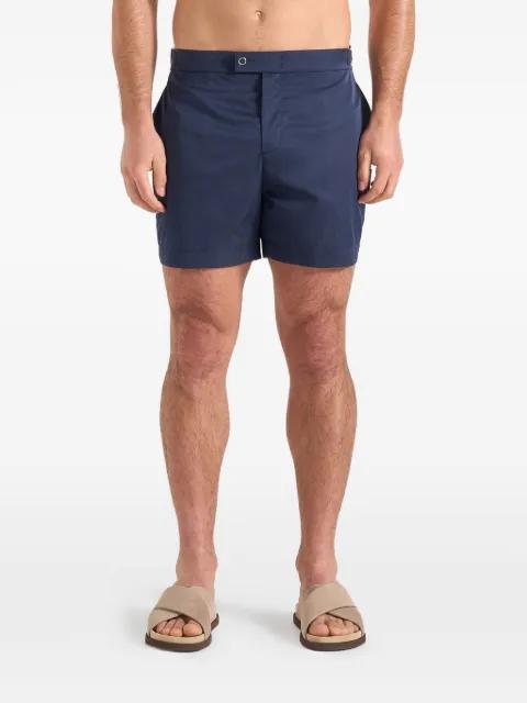 Brian in navy polished nylon swim shorts by MANIERE DE VOIR