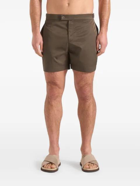 Brian in olive polished nylon swim shorts by MANIERE DE VOIR