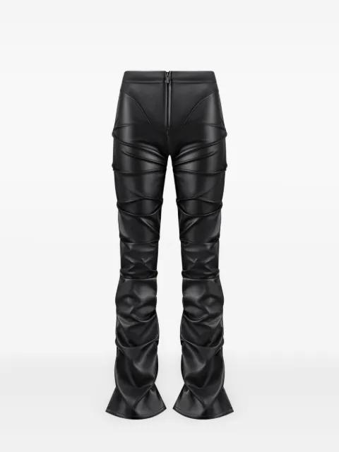 Caroline in black tacked leather fit & flare trousers by MANIERE DE VOIR